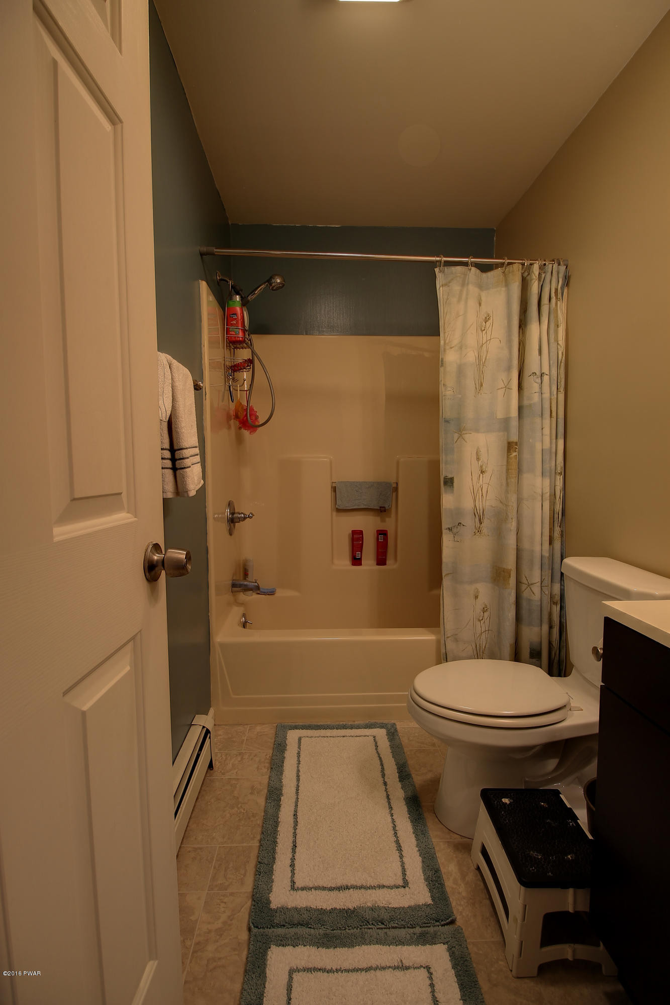 5630 Haas Pond Road Moscow, PA 18444 - Photo 22 of 42 a bathroom with a sink a toilet a mirror and shower