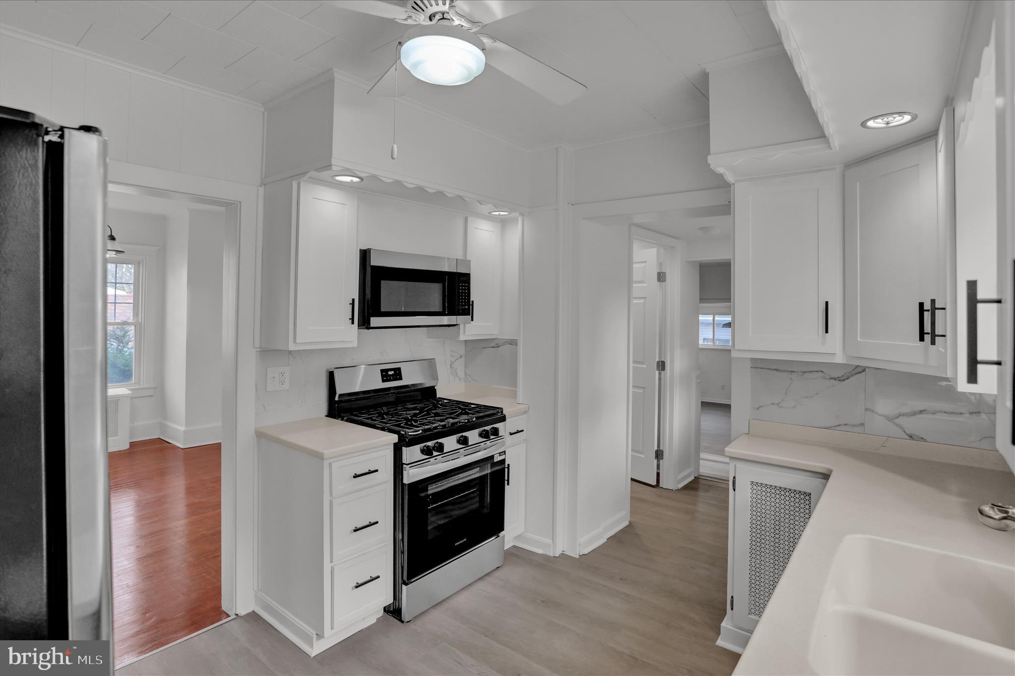 405 State Street Reading, PA 19607 - Photo 14 of 42 a kitchen with granite countertop a sink appliances and cabinets