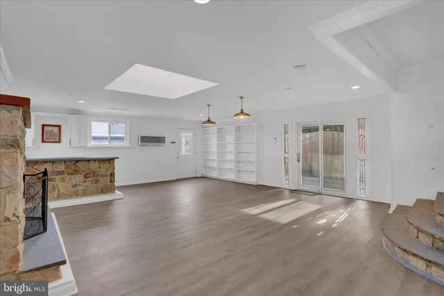 a view of a livingroom with wooden floor