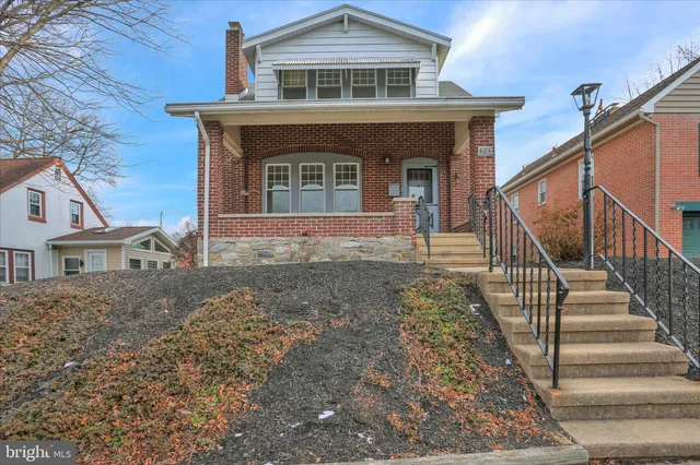 front view of a house with a small yard