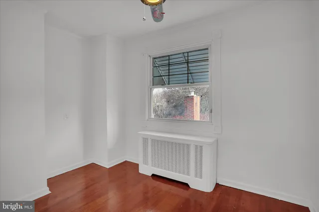 a view of staircase with wooden floor