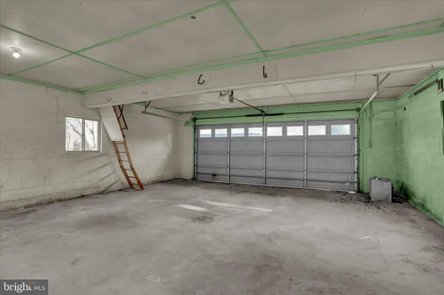 a view of an empty room with windows