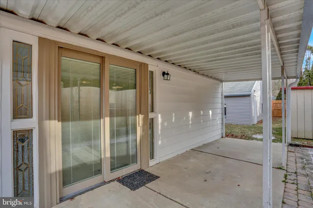 a bathroom with a glass door shower and sink