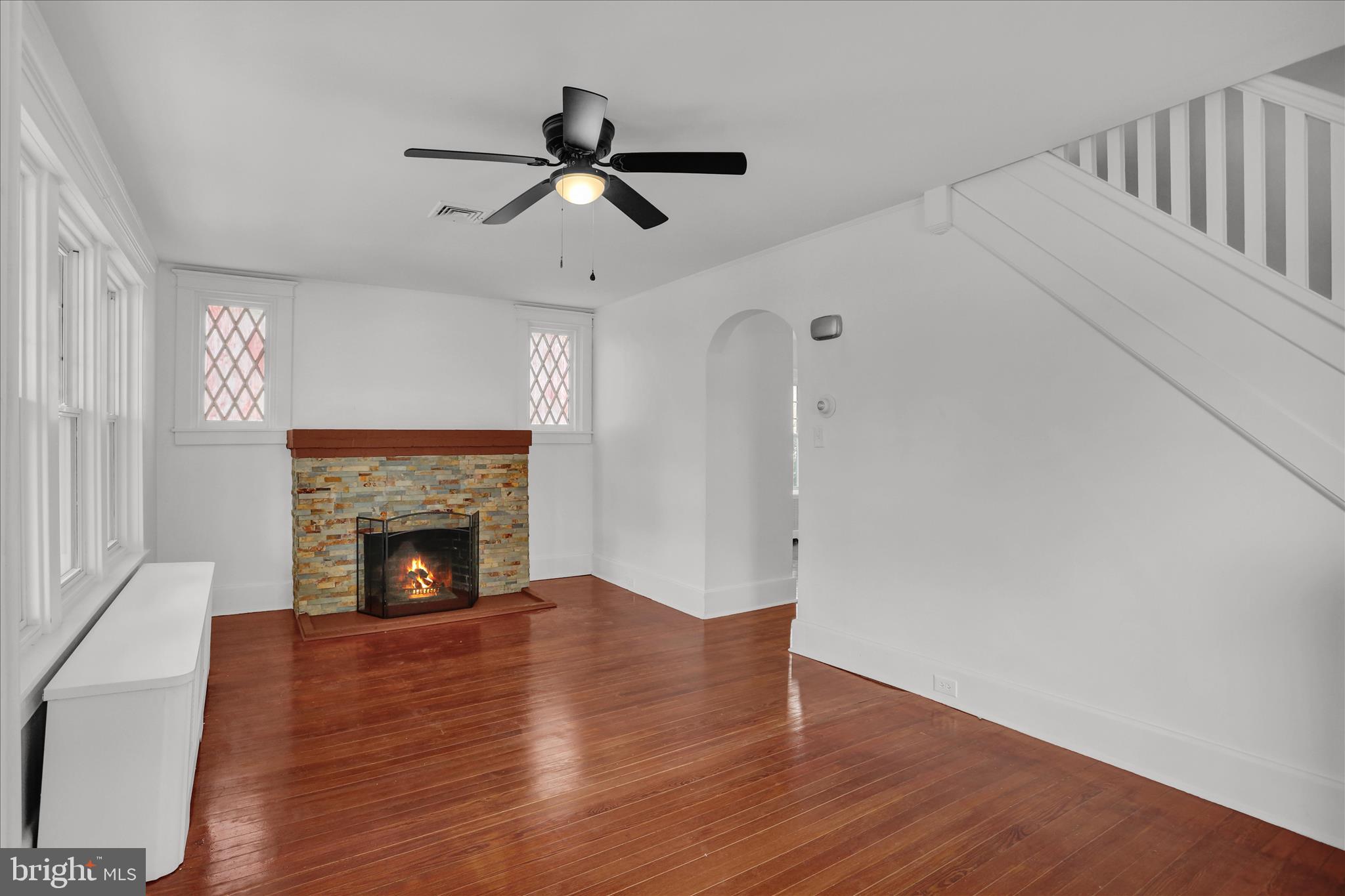 405 State Street Reading, PA 19607 - Photo 6 of 42 a view of empty room with wooden floor fireplace and a window