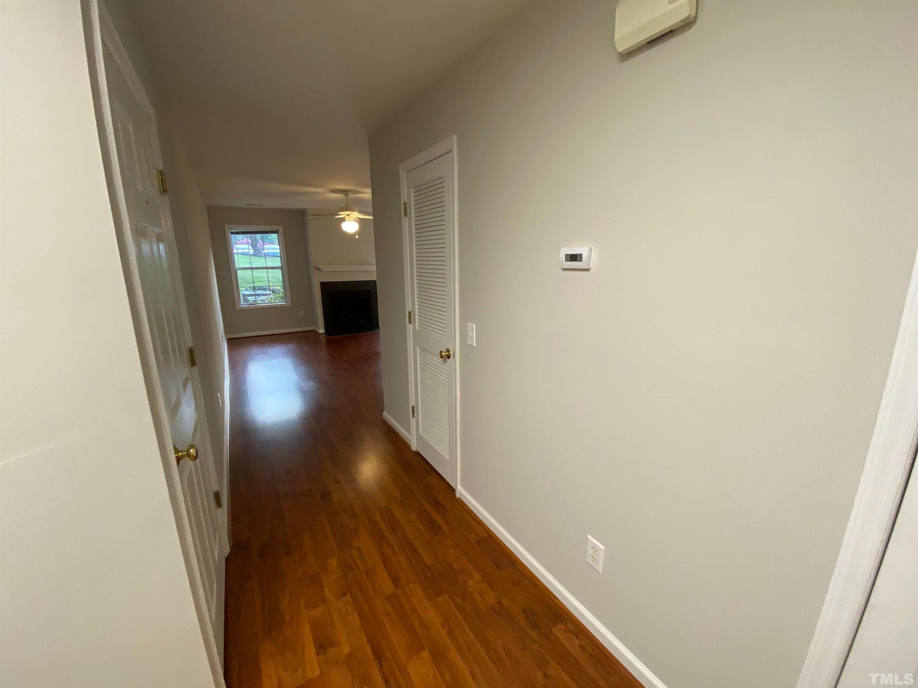 2413 Wellington Ridge Loop, Unit 2413 Cary, NC 27518 - Photo 5 of 30 a view of a hallway with wooden floor