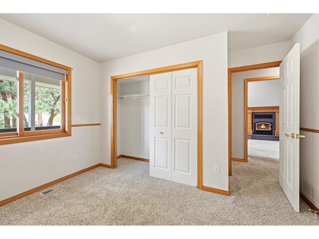 256 Choctaw Road Lyons, CO 80540 - Photo 22 of 50 an empty room that has a window and kitchen view