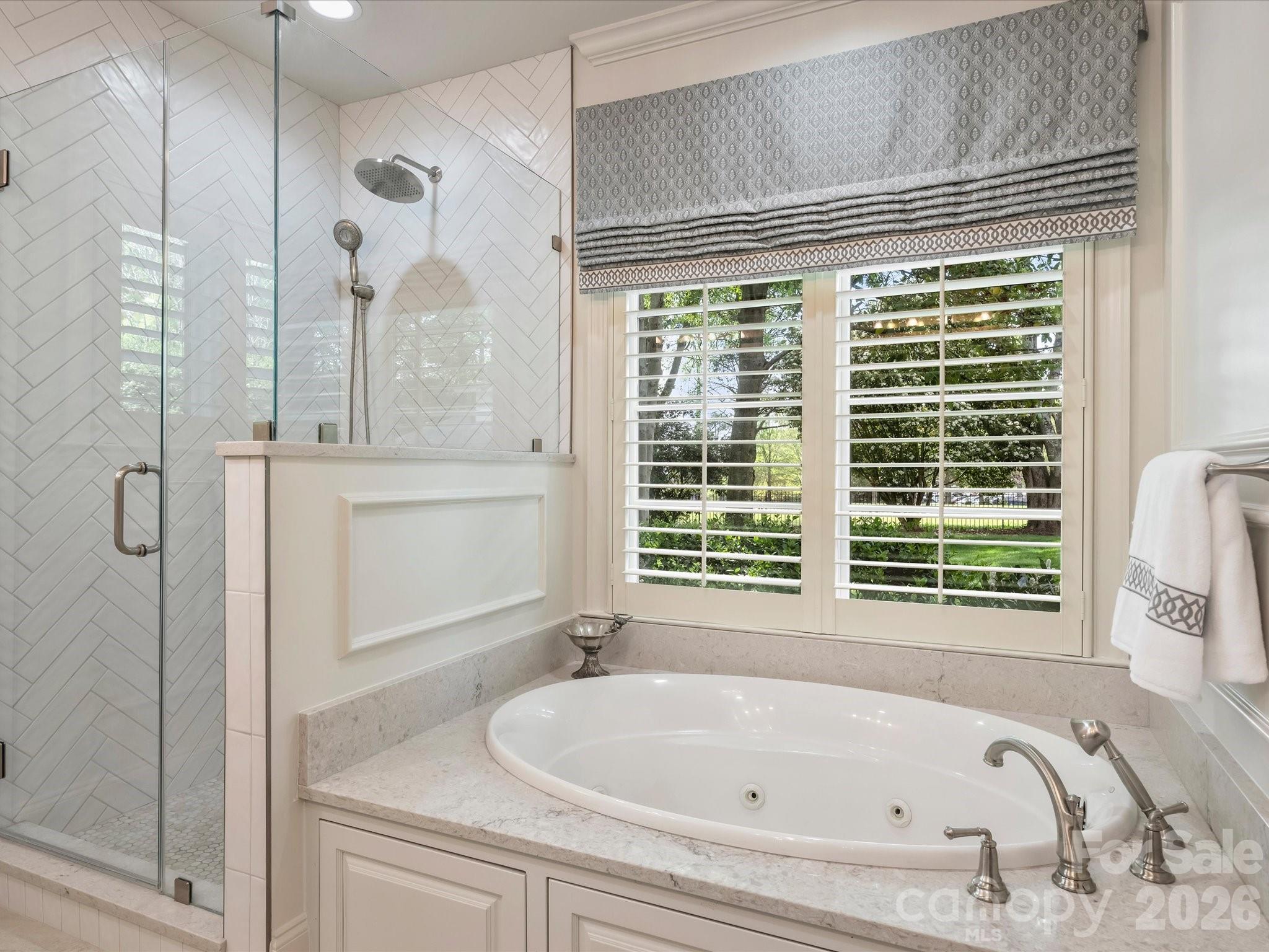 4330 Carmel Valley Road Charlotte, NC 28226 - Photo 19 of 38 a bathroom with shower and a bathtub