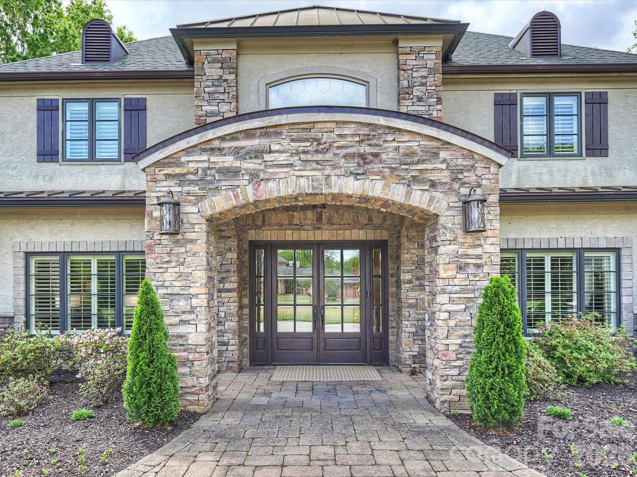 4330 Carmel Valley Road Charlotte, NC 28226 - Photo 3 of 38 a front view of a house with garden