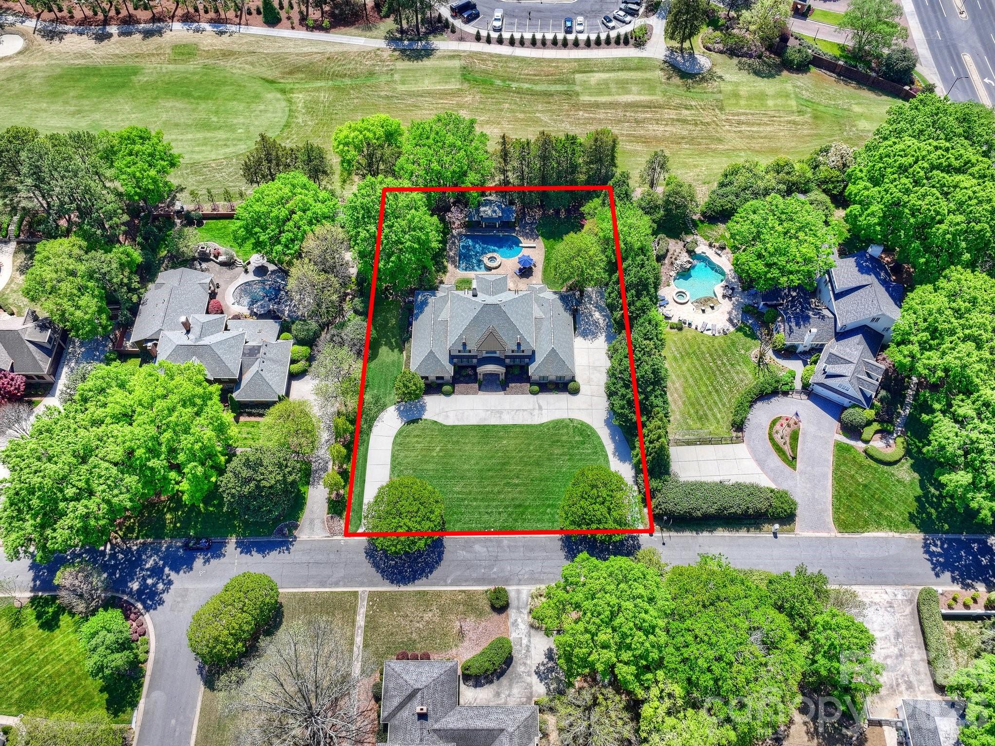 4330 Carmel Valley Road Charlotte, NC 28226 - Photo 35 of 38 an aerial view of a house with outdoor space swimming pool patio and lake view