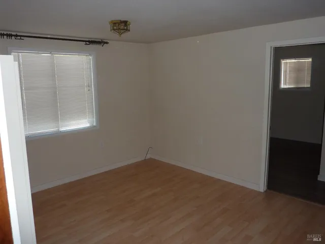 a kitchen with a refrigerator and a stove