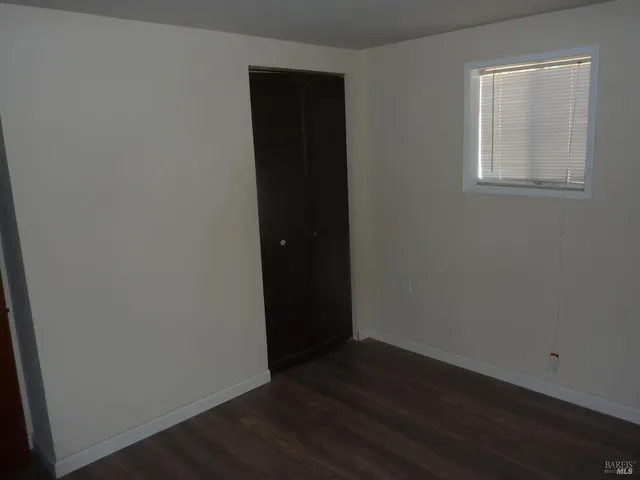 a kitchen with stainless steel appliances granite countertop a sink stove and wooden floor