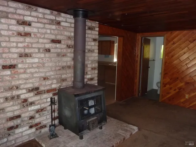 a view of fireplace and window