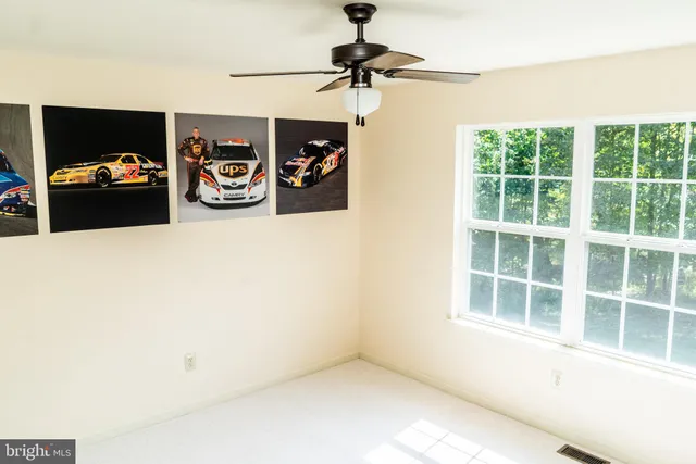 a bathroom with a sink a toilet a mirror and window