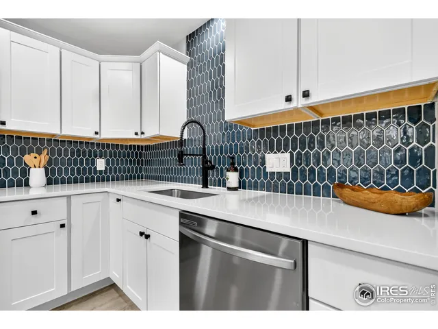 a kitchen with stainless steel appliances a cabinets and sink
