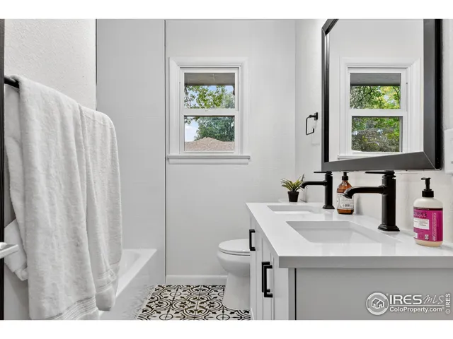 a bedroom with a bed and a chair