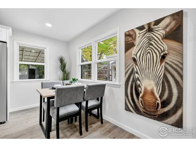 a view of a dining room with furniture window and backyard