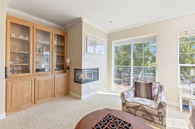 a living room with furniture and windows