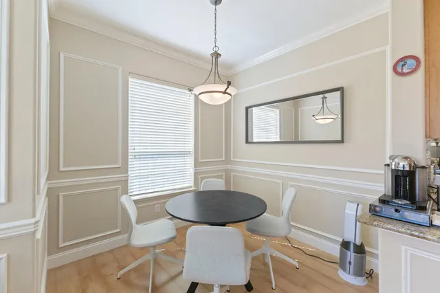a kitchen with a table and chairs in it
