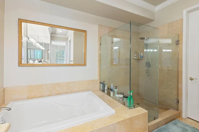 a bath tub sitting next to a bathroom sink