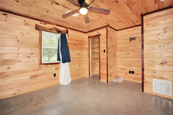 a bathroom with a sink toilet vanity and shower