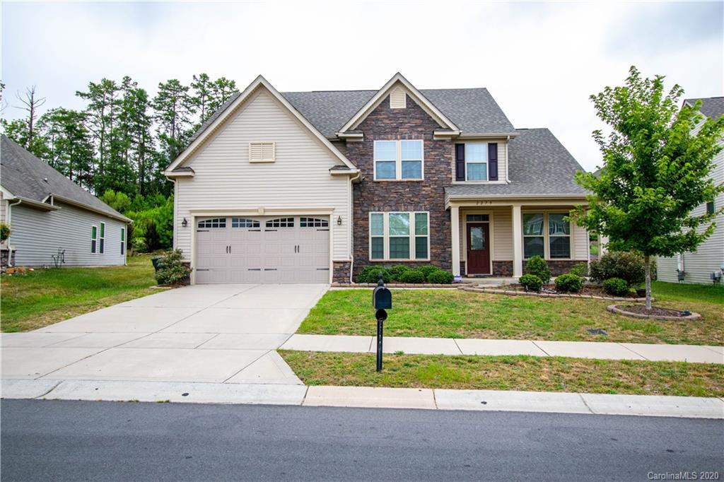 2279 Drake Mill Lane Southwest Concord, NC 28025 - Photo 1 of 40 a front view of a house with a yard and garage