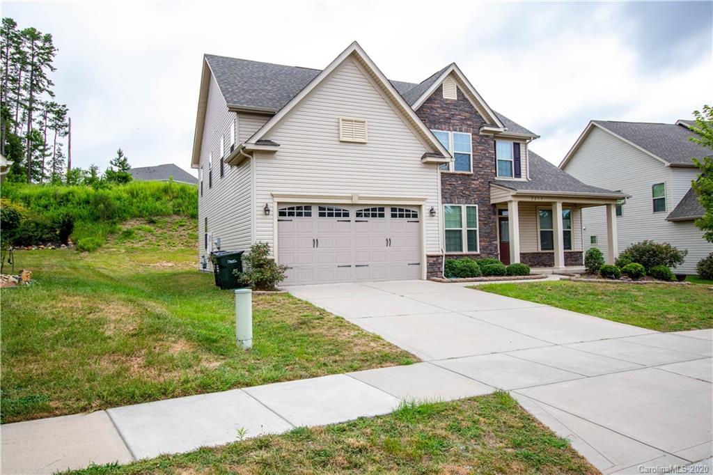 2279 Drake Mill Lane Southwest Concord, NC 28025 - Photo 2 of 40 a front view of a house with a yard and garage
