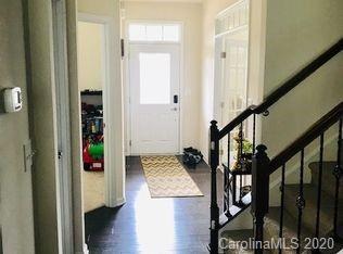 2279 Drake Mill Lane Southwest Concord, NC 28025 - Photo 4 of 40 a view of hallway with stairs and wooden floor