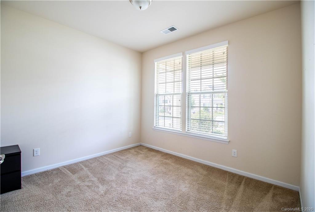 2279 Drake Mill Lane Southwest Concord, NC 28025 - Photo 7 of 40 an empty room with a window
