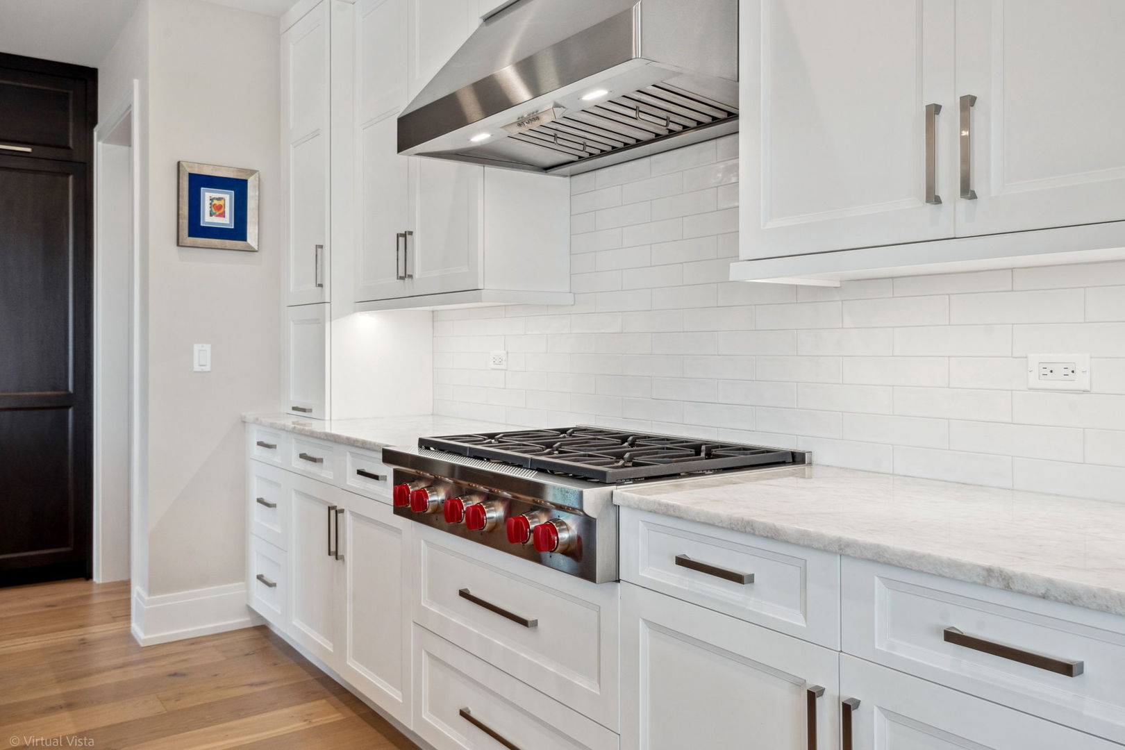 110 South Washington Street, Unit 400 Naperville, IL 60540 - Photo 11 of 34 a kitchen with white cabinets and appliances