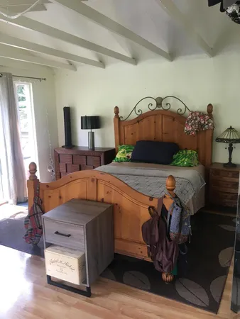 a view of living room with furniture and wooden floor
