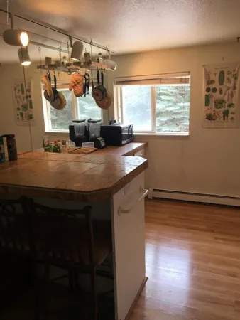 a room with a table and chairs