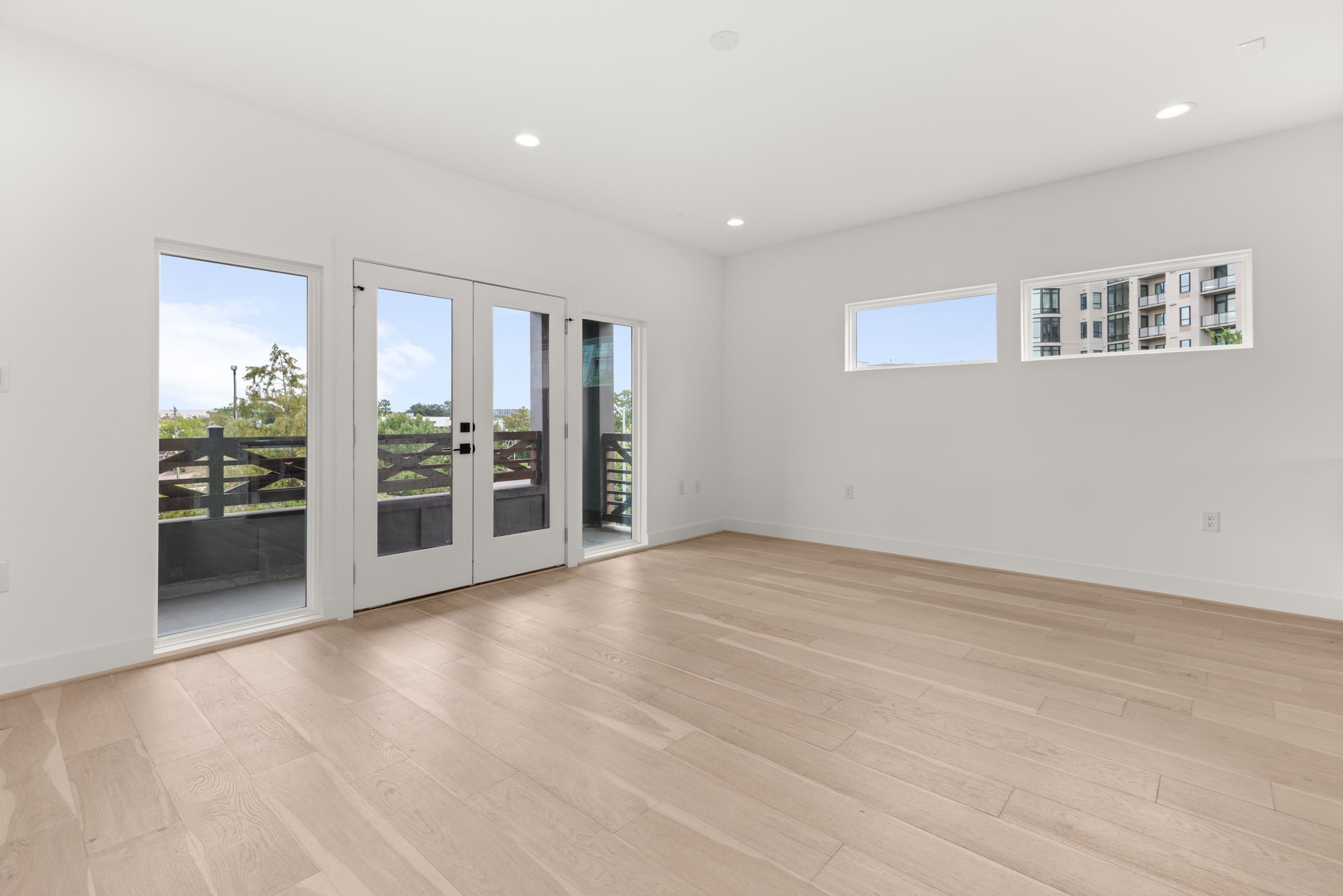 6209 Westcott Street Houston, TX 77007 - Photo 15 of 29 Versatile third-floor bonus area with French doors opening to a private balcony, ideal for a game room, lounge, or home office.