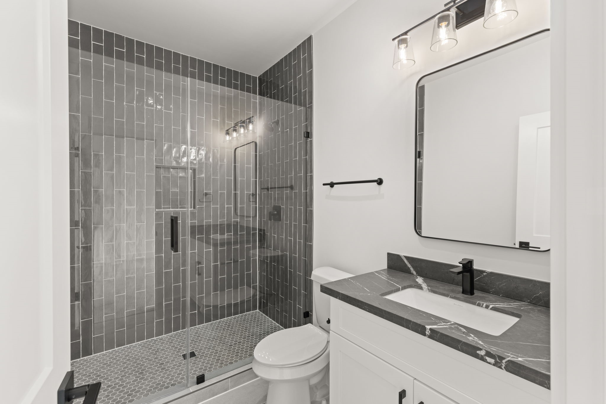 6209 Westcott Street Houston, TX 77007 - Photo 20 of 29 Sophisticated third-floor full bath with glass-enclosed shower, sleek vanity, and designer fixtures.