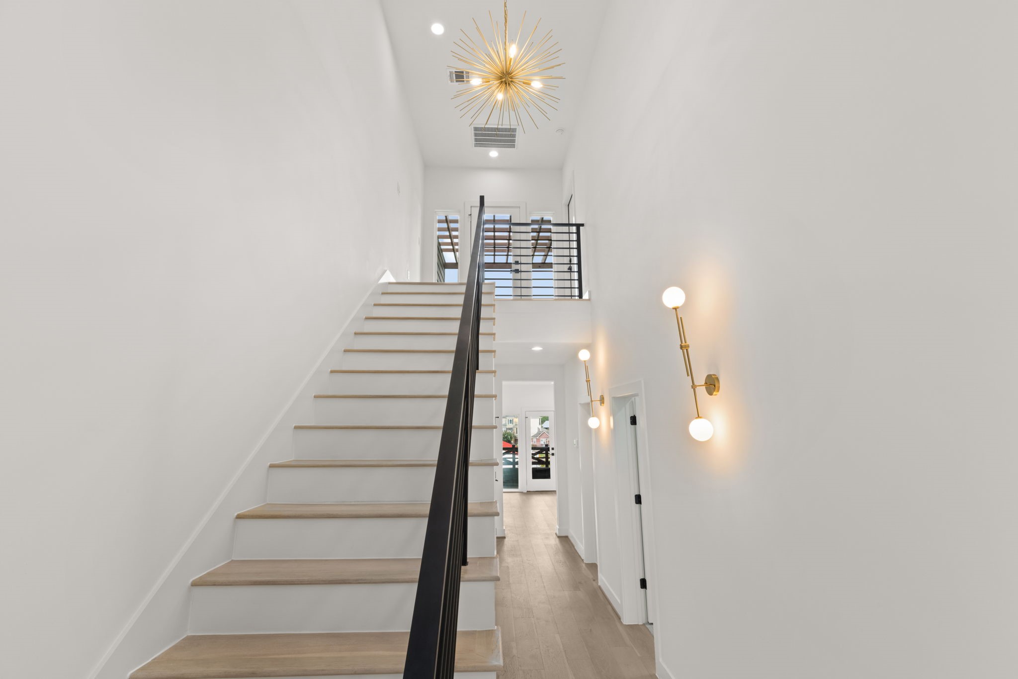 6209 Westcott Street Houston, TX 77007 - Photo 23 of 29 Statement stairway with designer lighting leading to the fourth floor and private rooftop terrace.