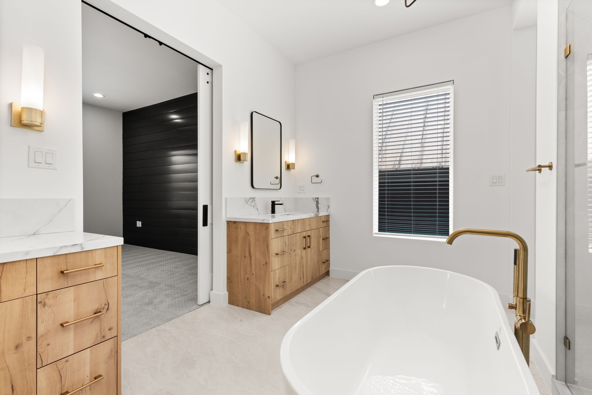 6209 Westcott Street Houston, TX 77007 - Photo 9 of 29 Another view of primary bath with dual vanities, soaking tub, and seamless flow into the private suite.