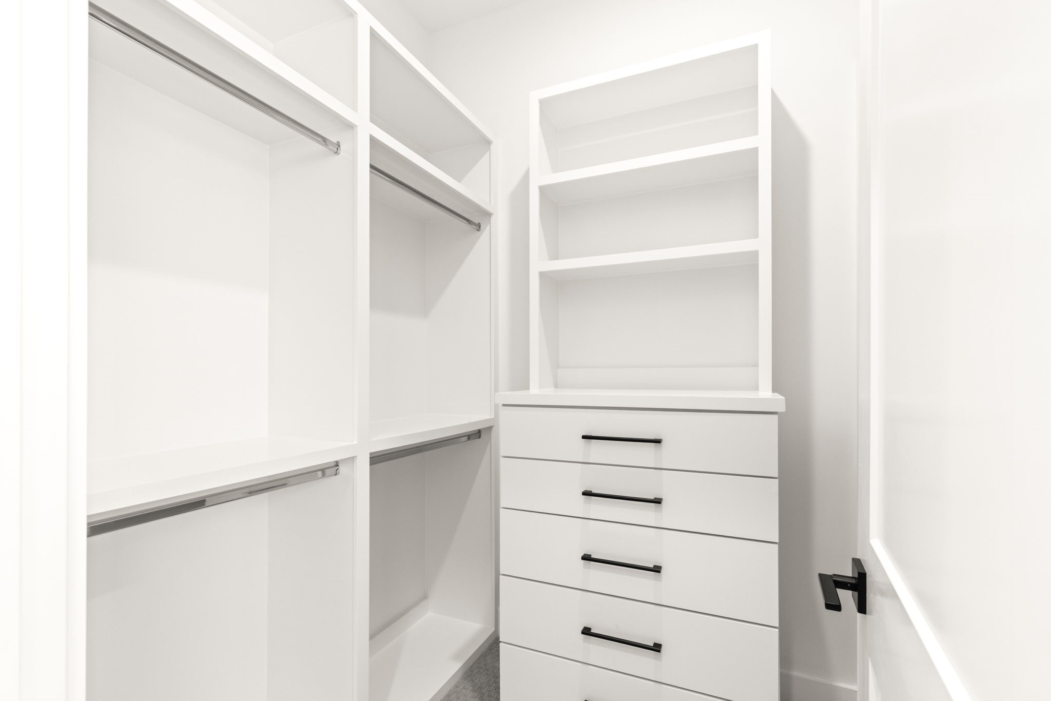 6209 Westcott Street Houston, TX 77007 - Photo 10 of 29 Expansive primary closet with custom built-ins, abundant shelving, and organized storage throughout.