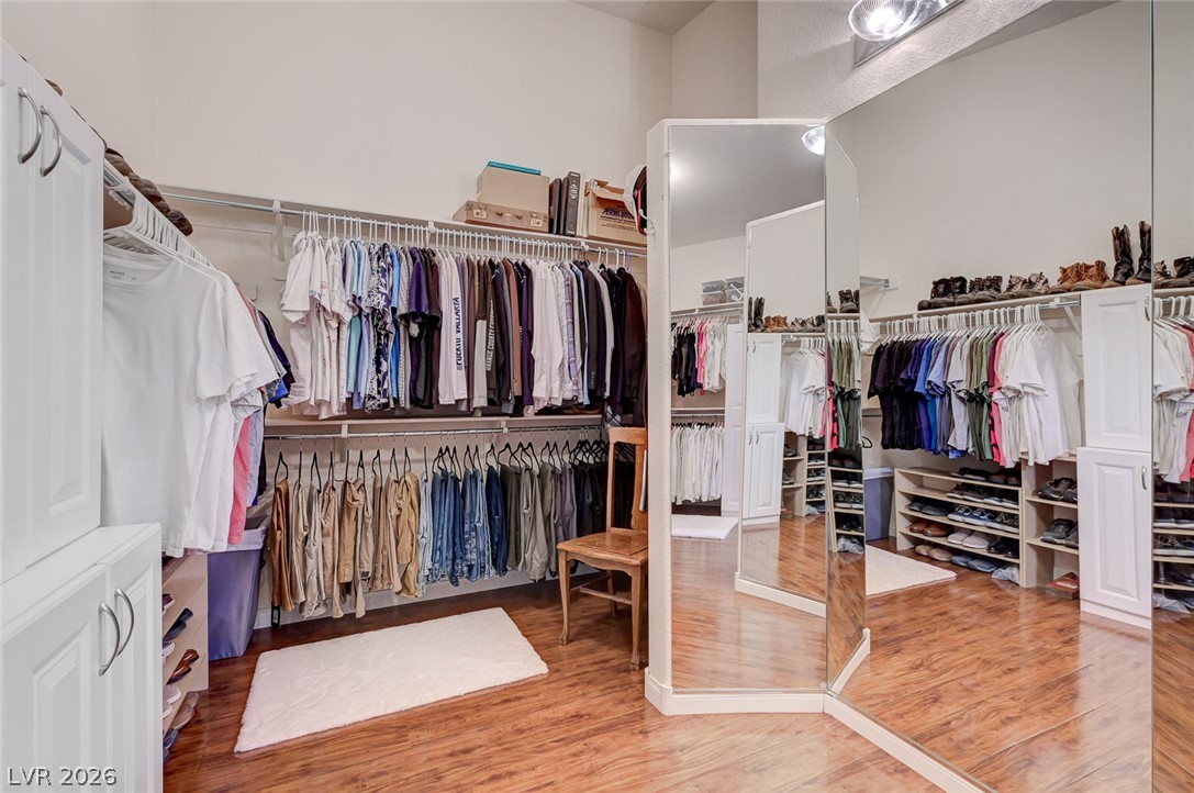 1604 Cattle Ranch Place Henderson, NV 89002 - Photo 46 of 99 Ample storage solutions and extensive hanging space define this functional and organized dressing area.