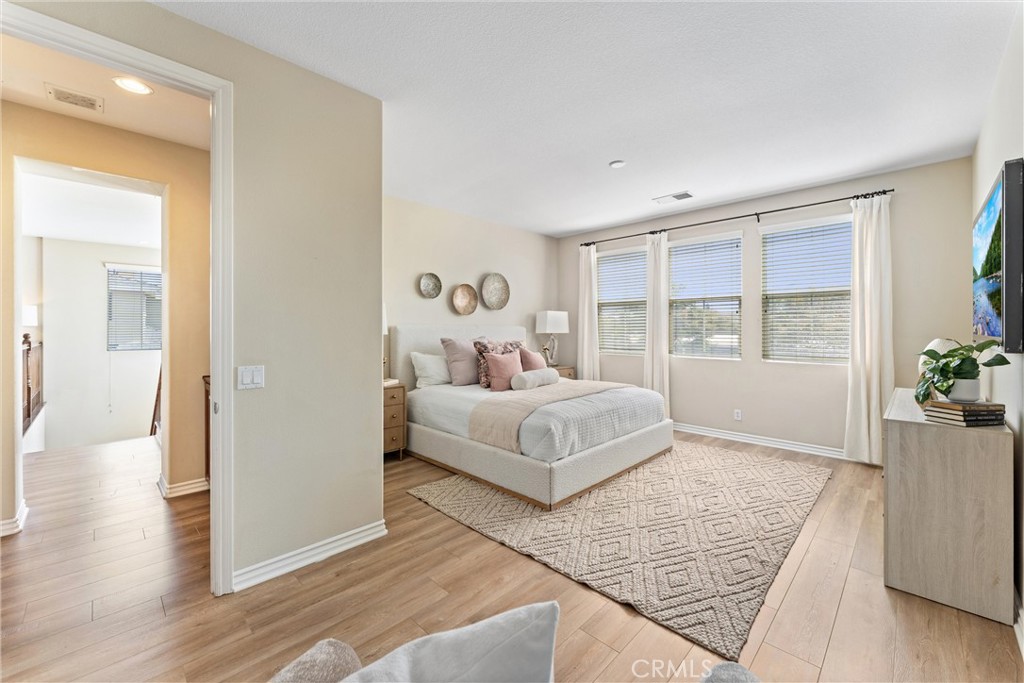 3229 Larkspur Street Tustin, CA 92782 - Photo 15 of 25 a bedroom with a large bed and a window