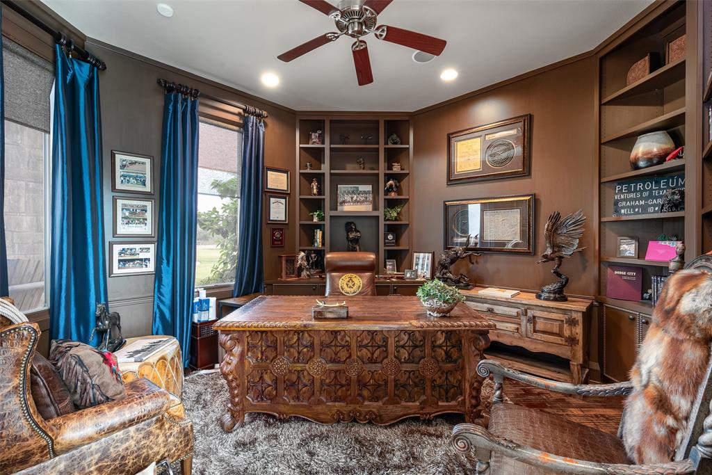 2312 Cactus Rio Lane Weatherford, TX 76087 - Photo 12 of 37 a living room with fireplace furniture and a flat screen tv