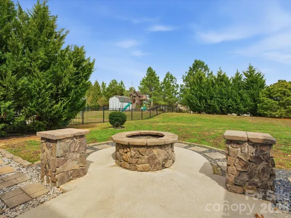 a view of a garden with an outdoor seating