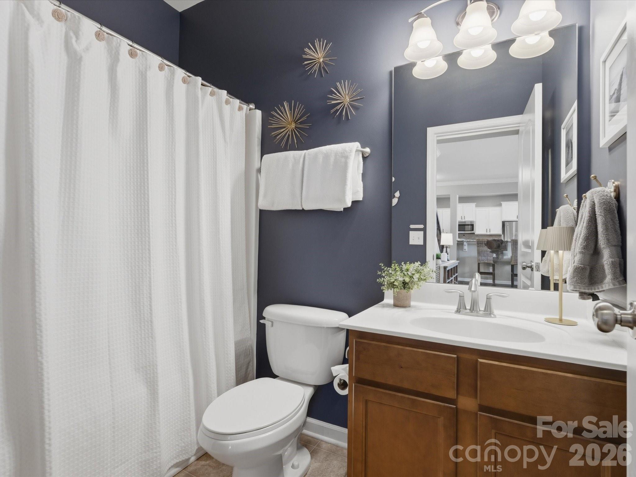 79321 Ridgehaven Road Lancaster, SC 29720 - Photo 14 of 35 a bathroom with a sink vanity mirror and toilet