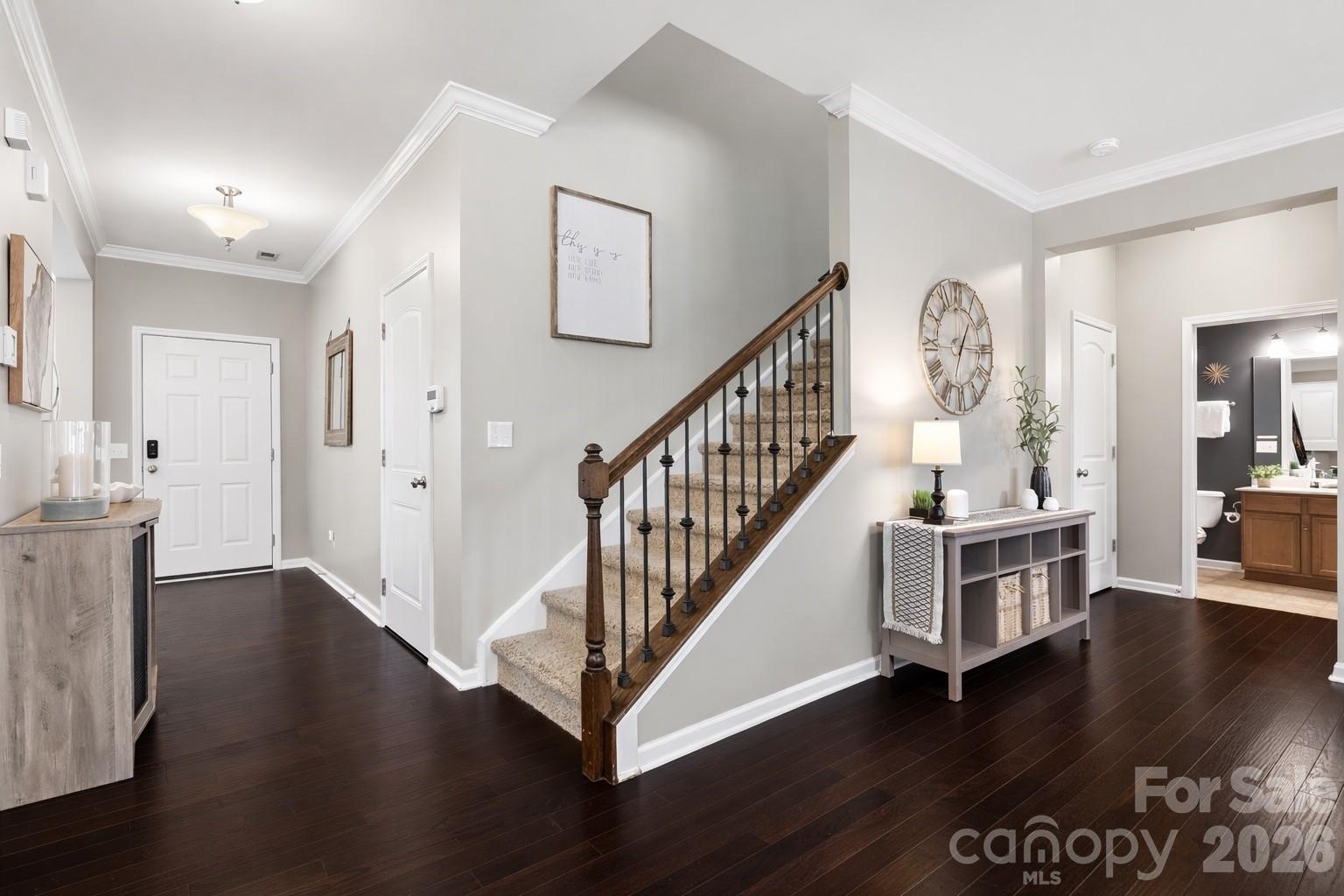 79321 Ridgehaven Road Lancaster, SC 29720 - Photo 16 of 35 a view of an entryway with wooden floor and a kitchen view