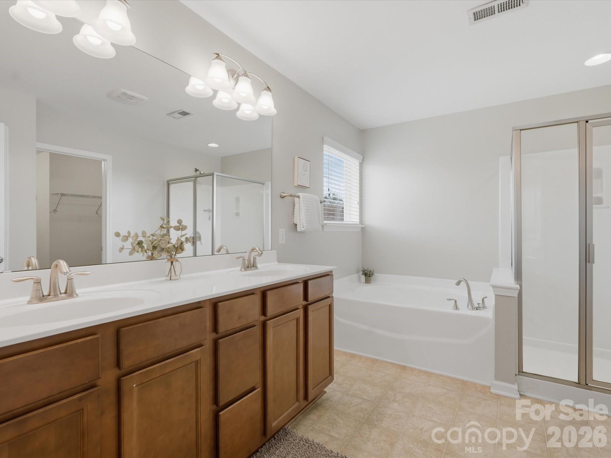 79321 Ridgehaven Road Lancaster, SC 29720 - Photo 20 of 35 a bathroom with a tub a sink and mirror