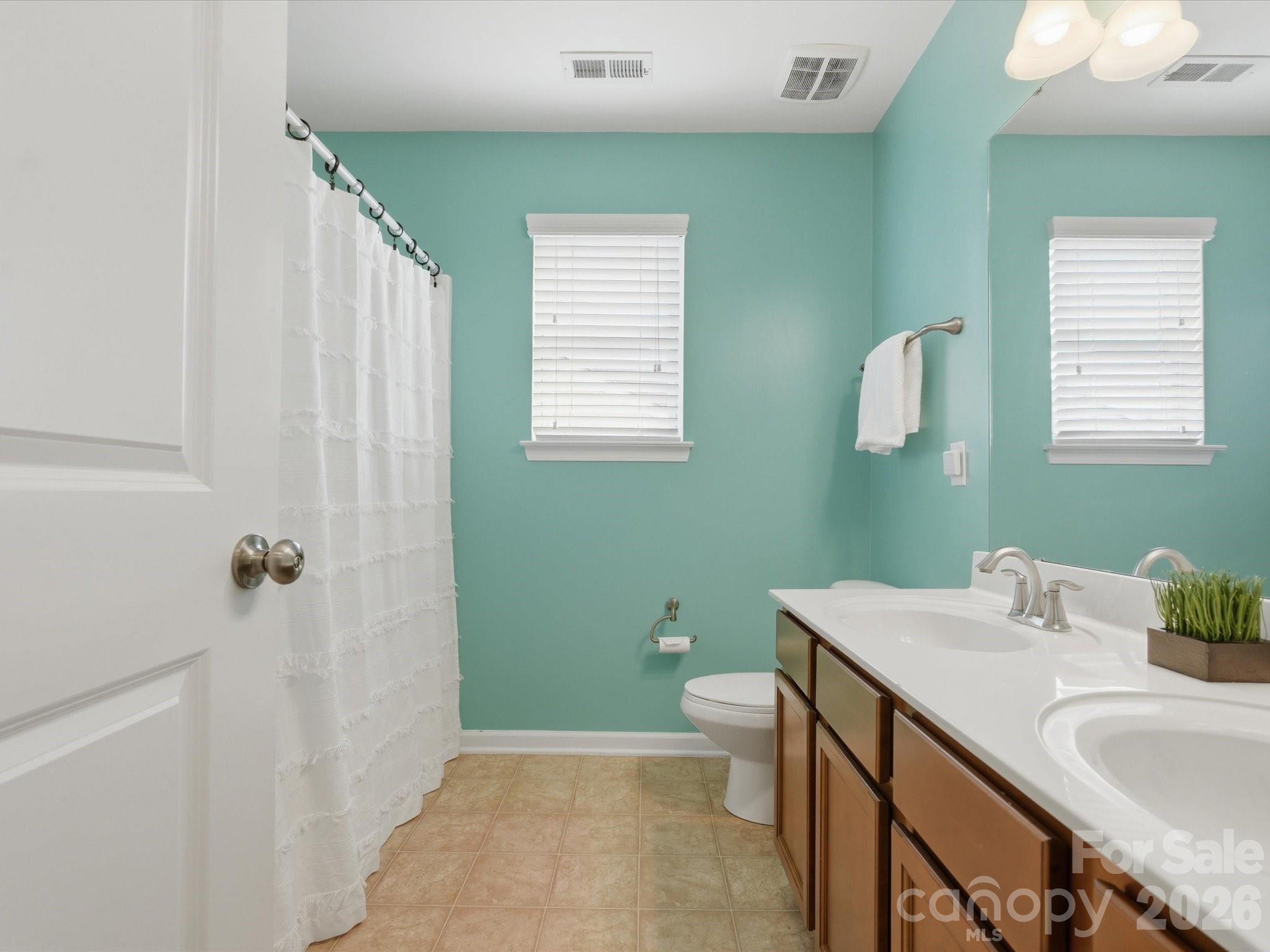 79321 Ridgehaven Road Lancaster, SC 29720 - Photo 30 of 35 a bathroom with a sink and toilet