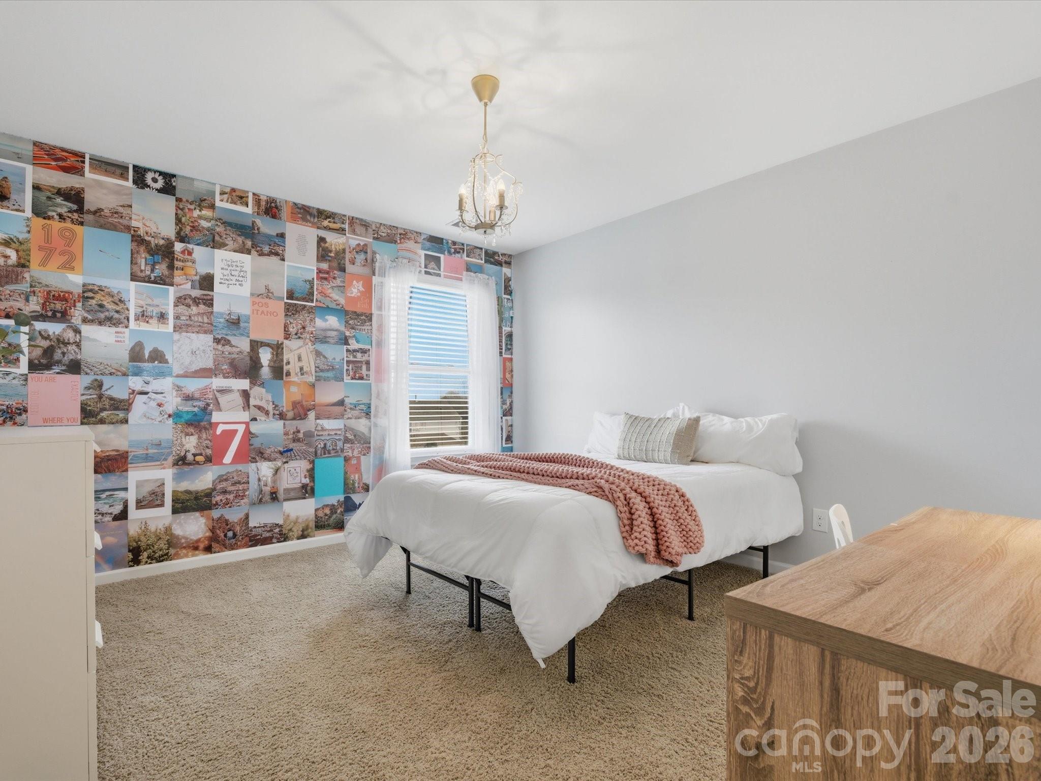 79321 Ridgehaven Road Lancaster, SC 29720 - Photo 31 of 35 a spacious bedroom with a bed and a chandelier