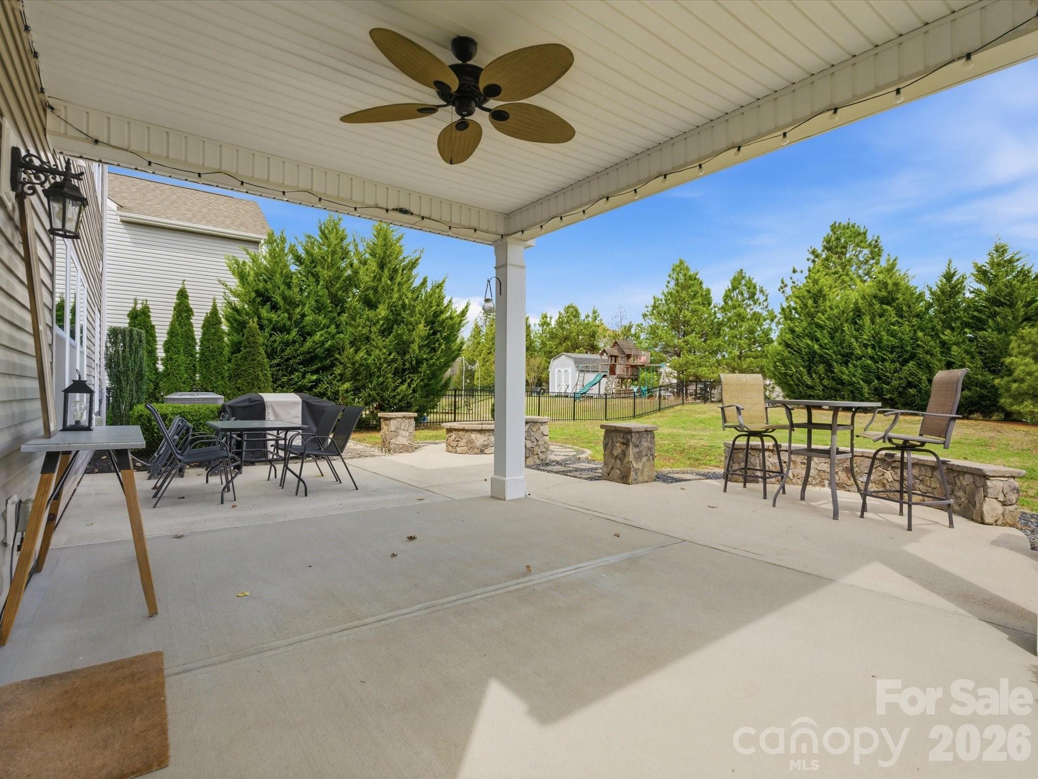79321 Ridgehaven Road Lancaster, SC 29720 - Photo 33 of 35 a view of a patio with a table and chairs