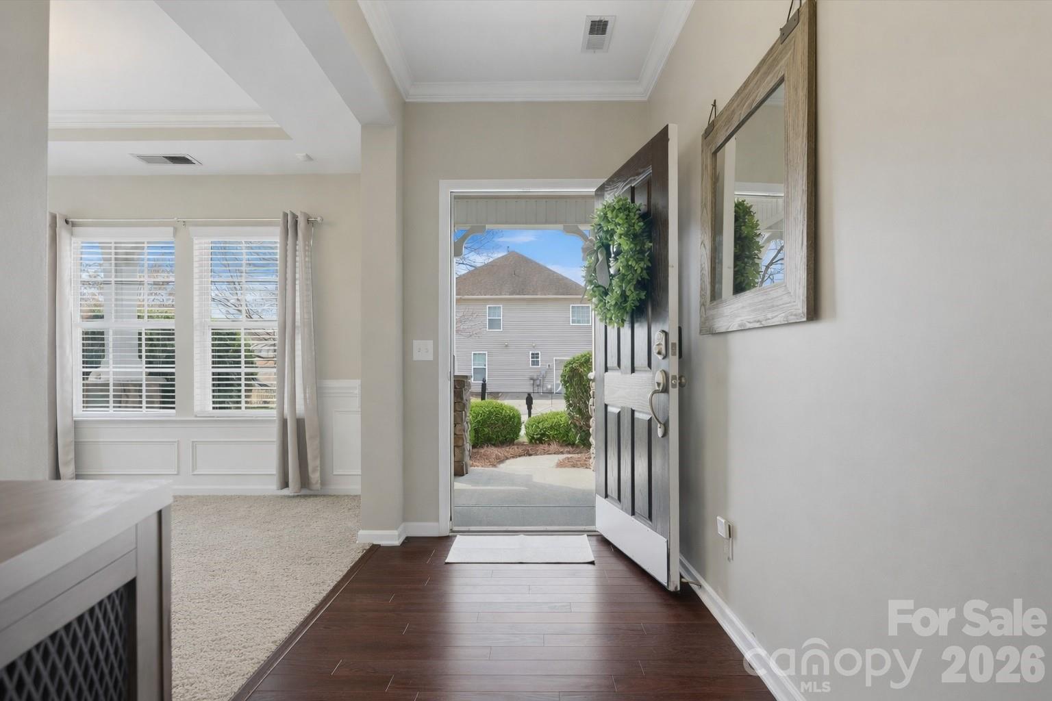 79321 Ridgehaven Road Lancaster, SC 29720 - Photo 5 of 35 a view of a hallway with wooden floor and a livingroom