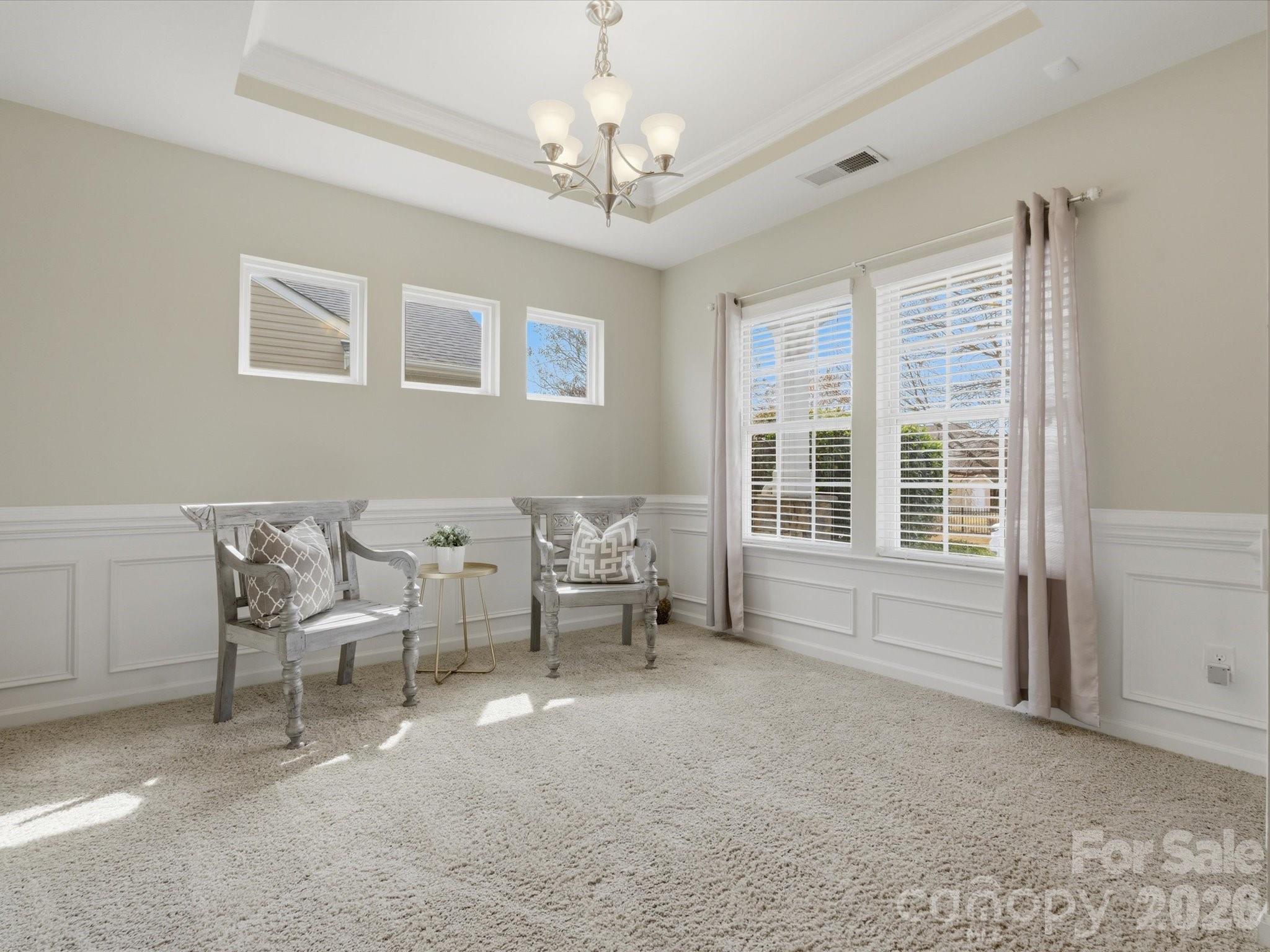 79321 Ridgehaven Road Lancaster, SC 29720 - Photo 6 of 35 a living room with furniture and a chandelier