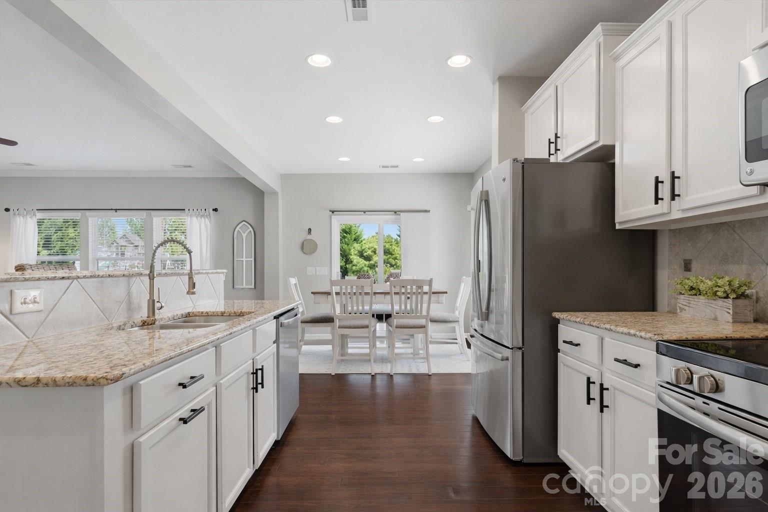 79321 Ridgehaven Road Lancaster, SC 29720 - Photo 8 of 35 a kitchen with stainless steel appliances granite countertop a sink stove and refrigerator