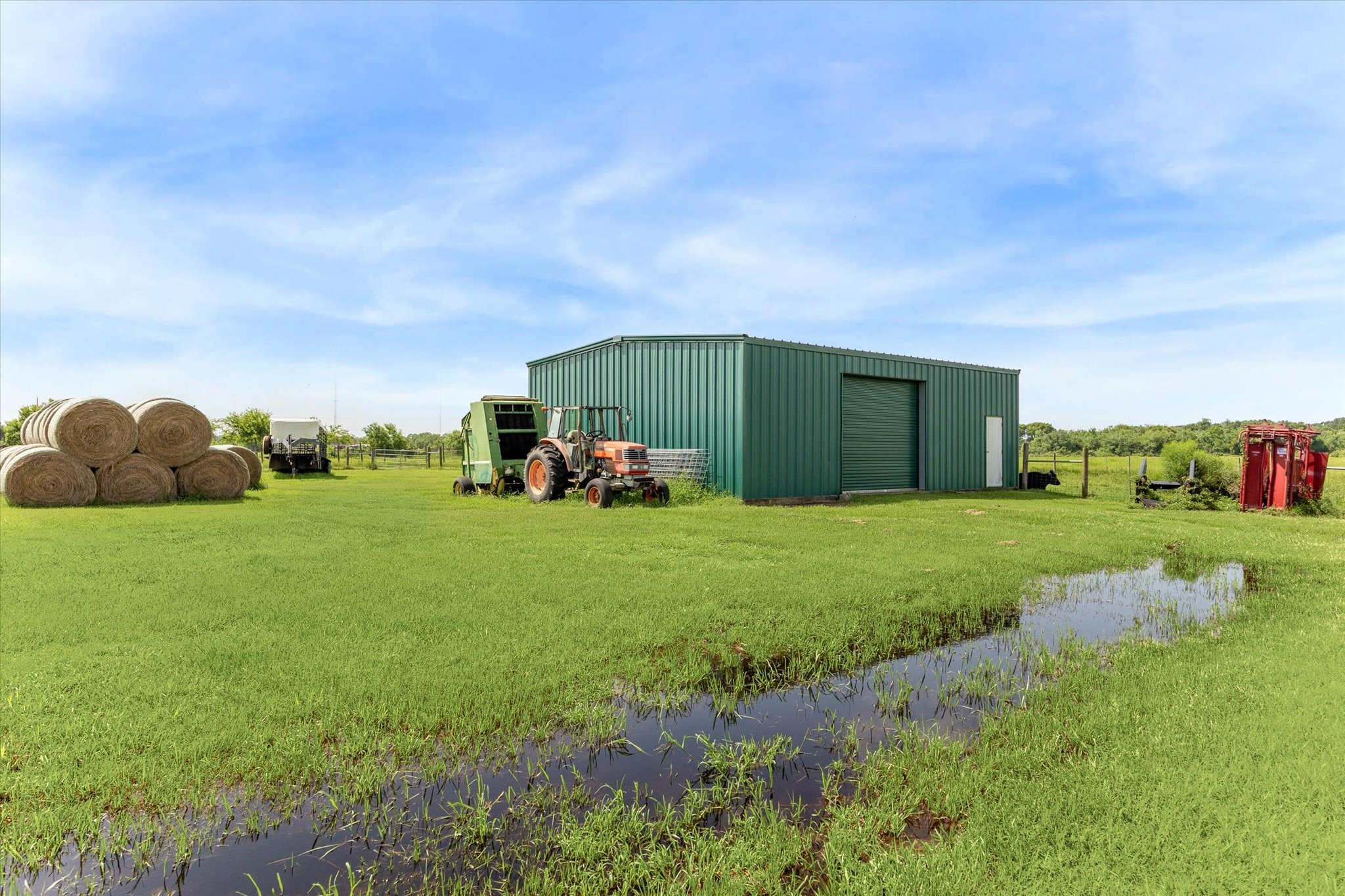 3850 Farm To Market 2917 Alvin, TX 77511 - Photo 28 of 30 a backyard of a house with lots of green space and plants